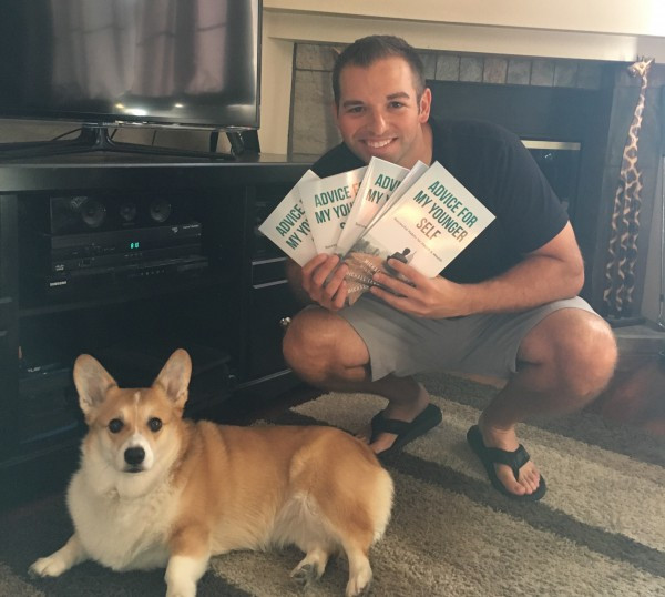 Portrait of Michael Leonard with his books and dog